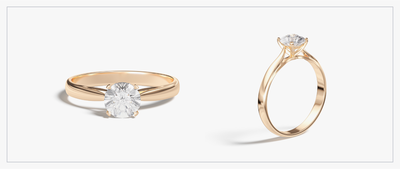 Front and side view of a yellow gold solitaire diamond ring
