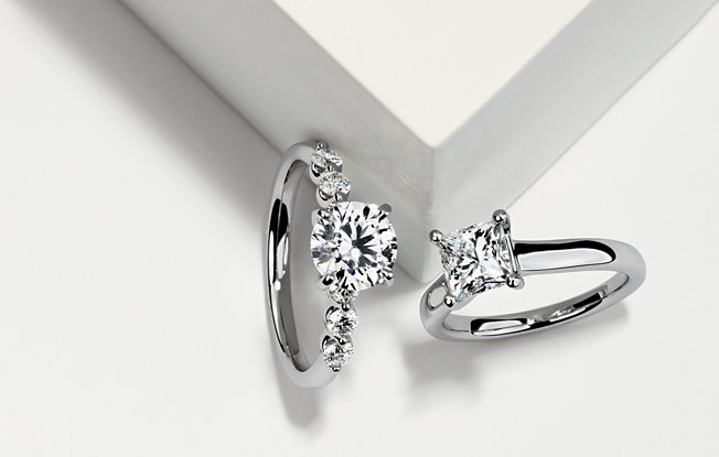 Round cut diamond engagement ring and princess cut diamond engagement solitaire