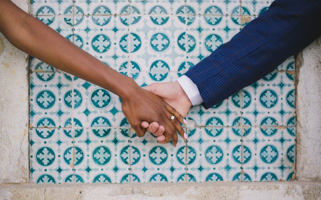 Close up of a couple holding hands