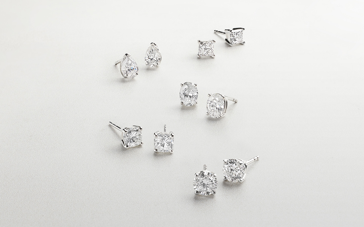 Diamond stud earrings in various shapes