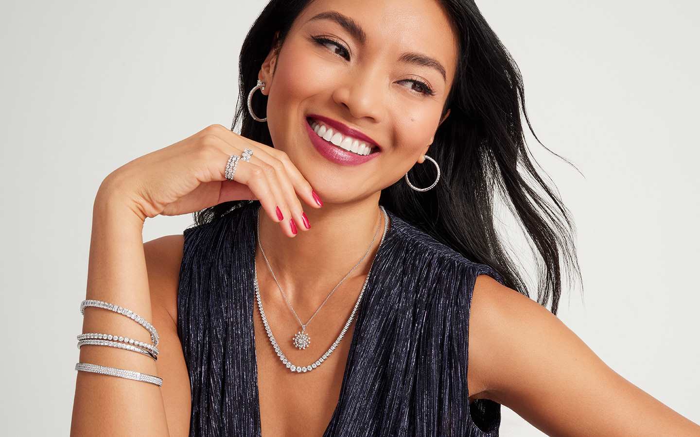 Woman wearing Blue Nile layering necklaces.