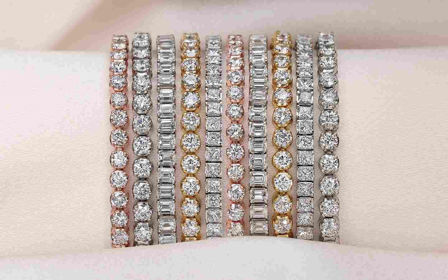 Diamond tennis bracelets in yellow, rose and white gold.