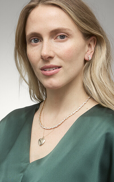 Woman wearing gold good luck jewelry