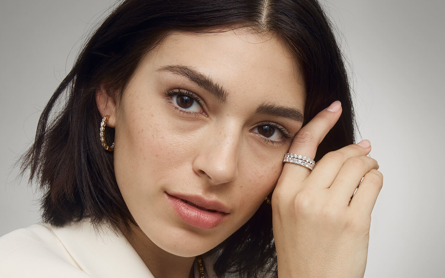 Close up of woman wearing diamond rings
