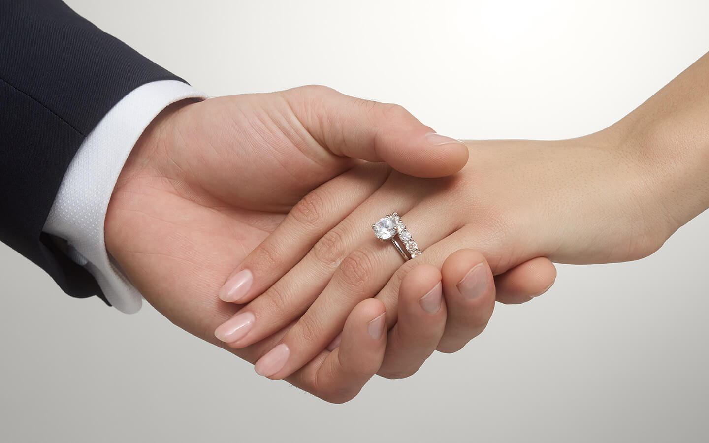 Close up of bride and groom hands