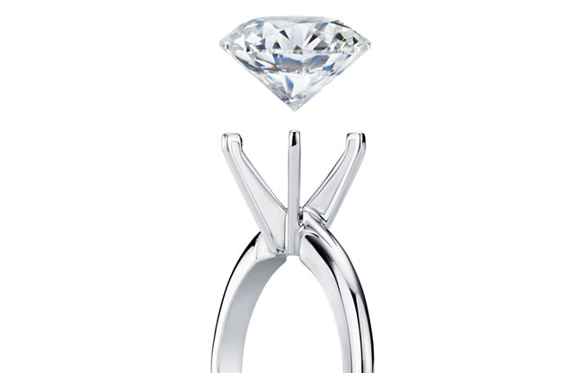 Diamond floating above an engagement ring setting