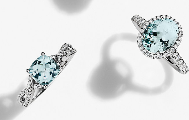 Two aquamarine engagement rings