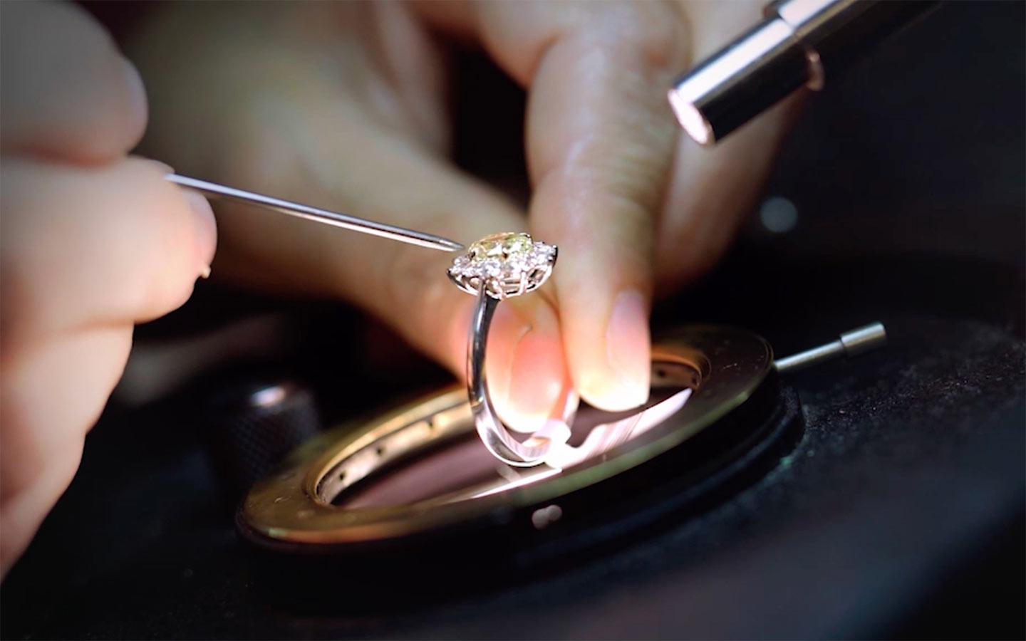 Close up of jeweler working on an engagement ring 