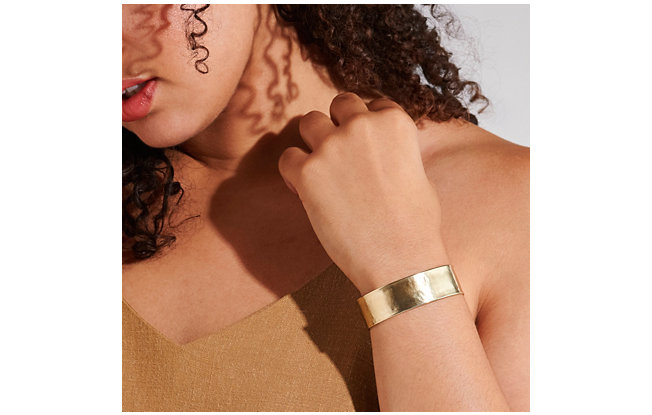 Woman wearing a Cuff Italian Gold Bracelet