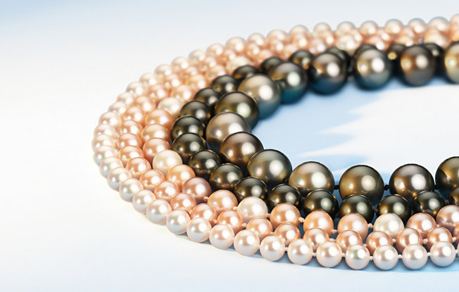 5 strands of Premier Akoya, Pink Freshwater, and Tahitian pearls displayed on a white background