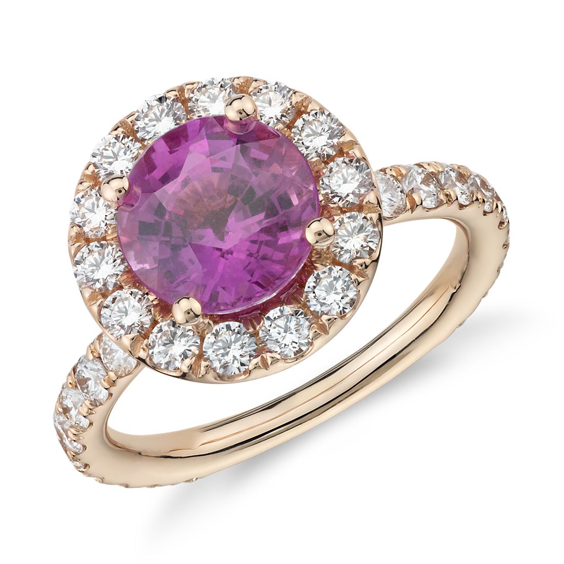 Pink sapphire ring with halo diamonds in yellow gold.