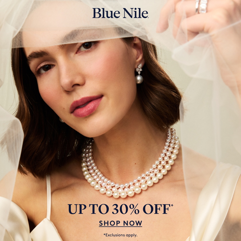 A bride model wearing wedding jewelry from Blue Nile