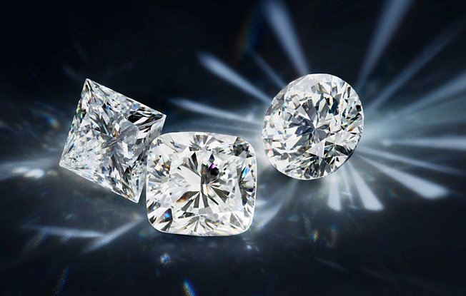 Princess, cushion, and round diamonds on a blue background