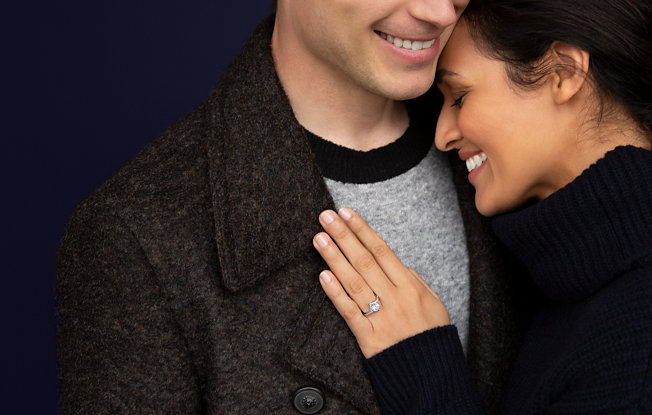 A couple embracing on a blue background