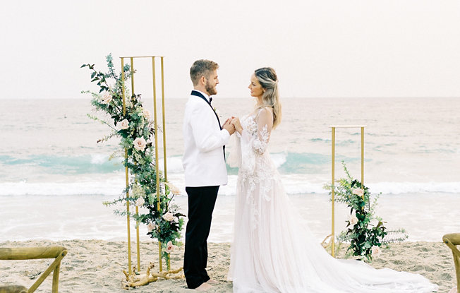A bride and groom at their beach wedding reception
