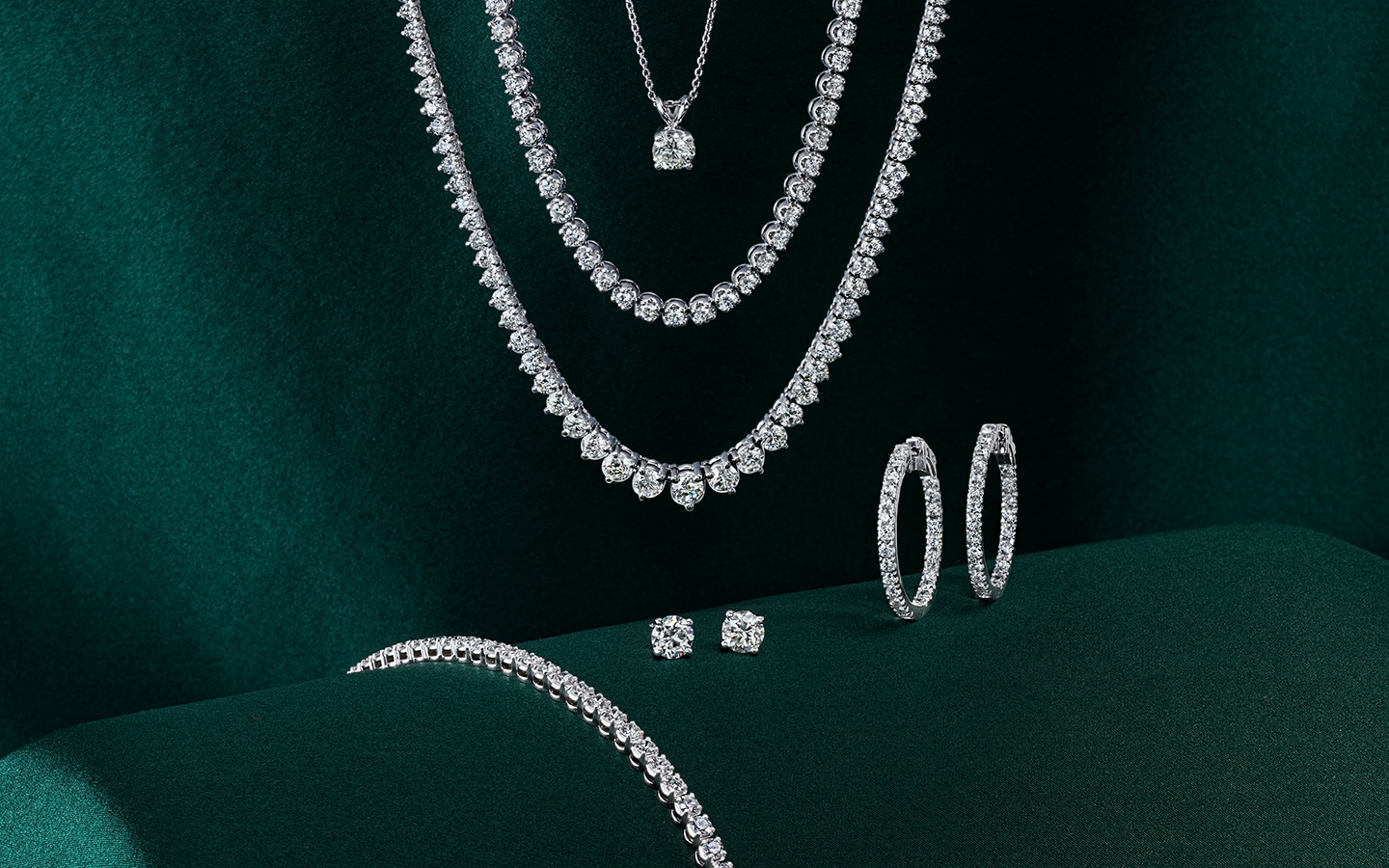 14k white gold and diamond necklaces, earrings and bracelet. 
