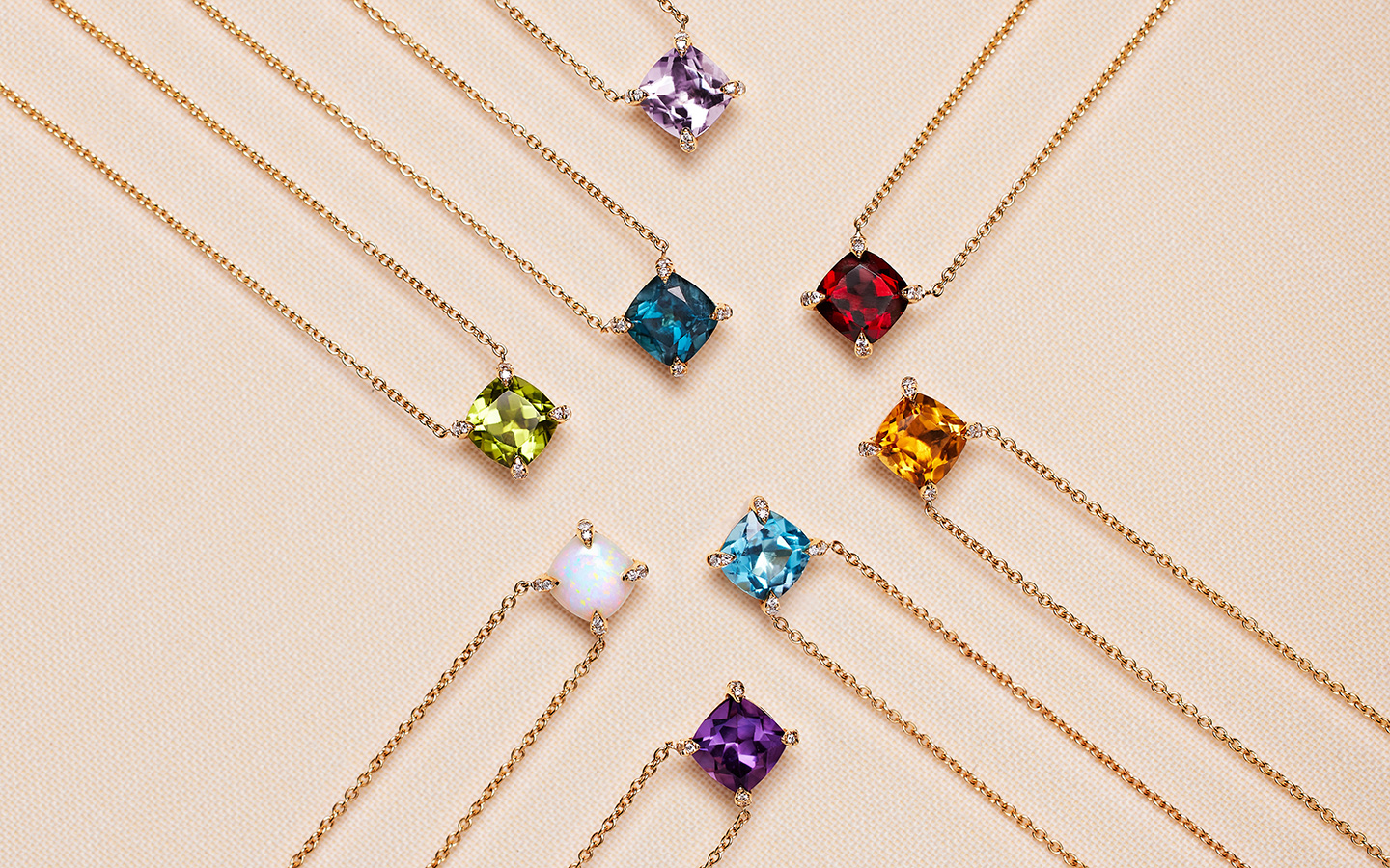 Birthstone necklaces including ones with opal, amethyst, topaz and peridot.