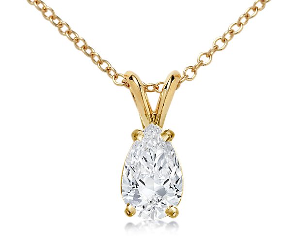 Custom yellow gold necklace with a pear diamond.