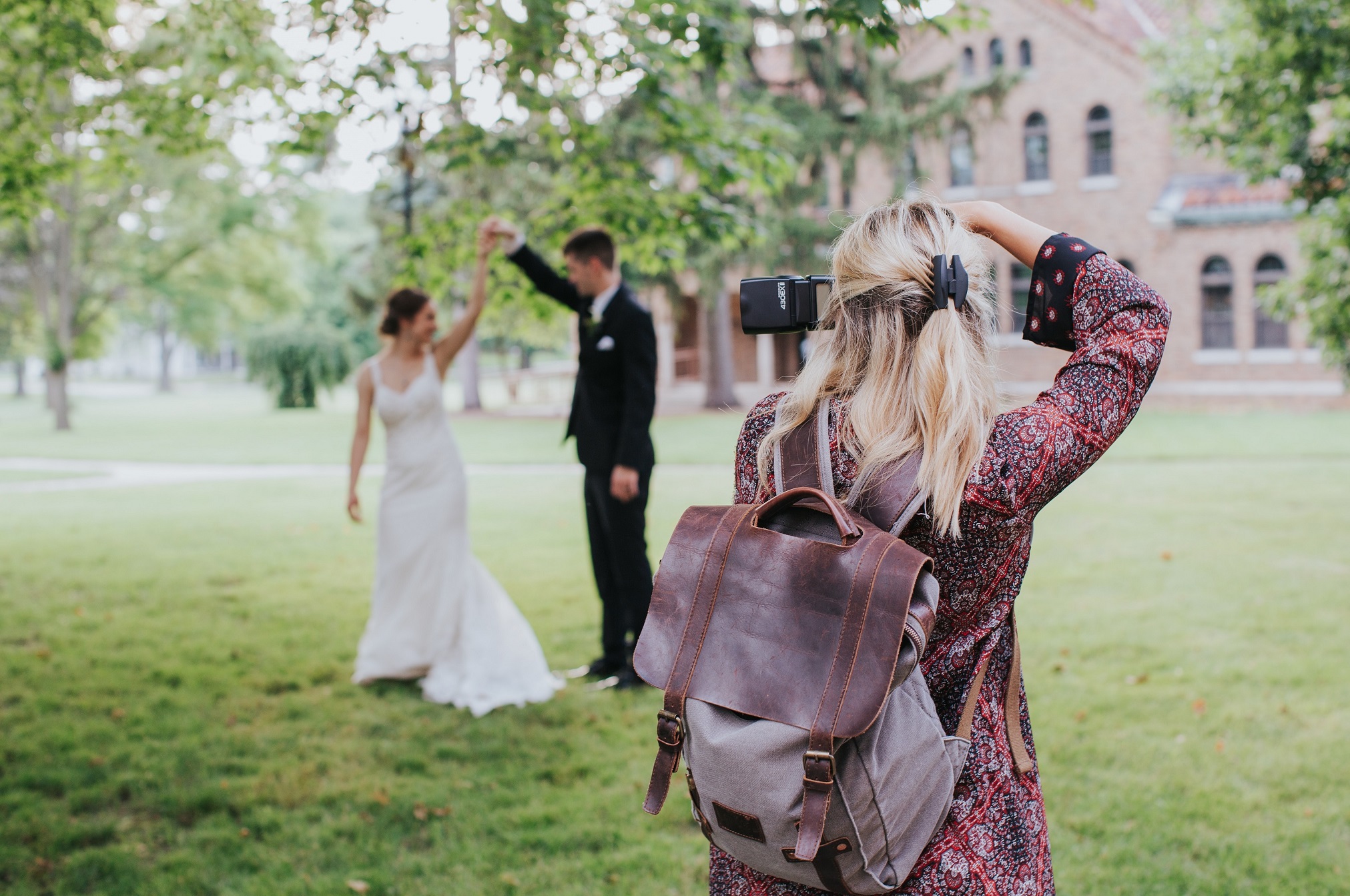 Wedding photographer taking a photo of a bride and groom during their elopement 