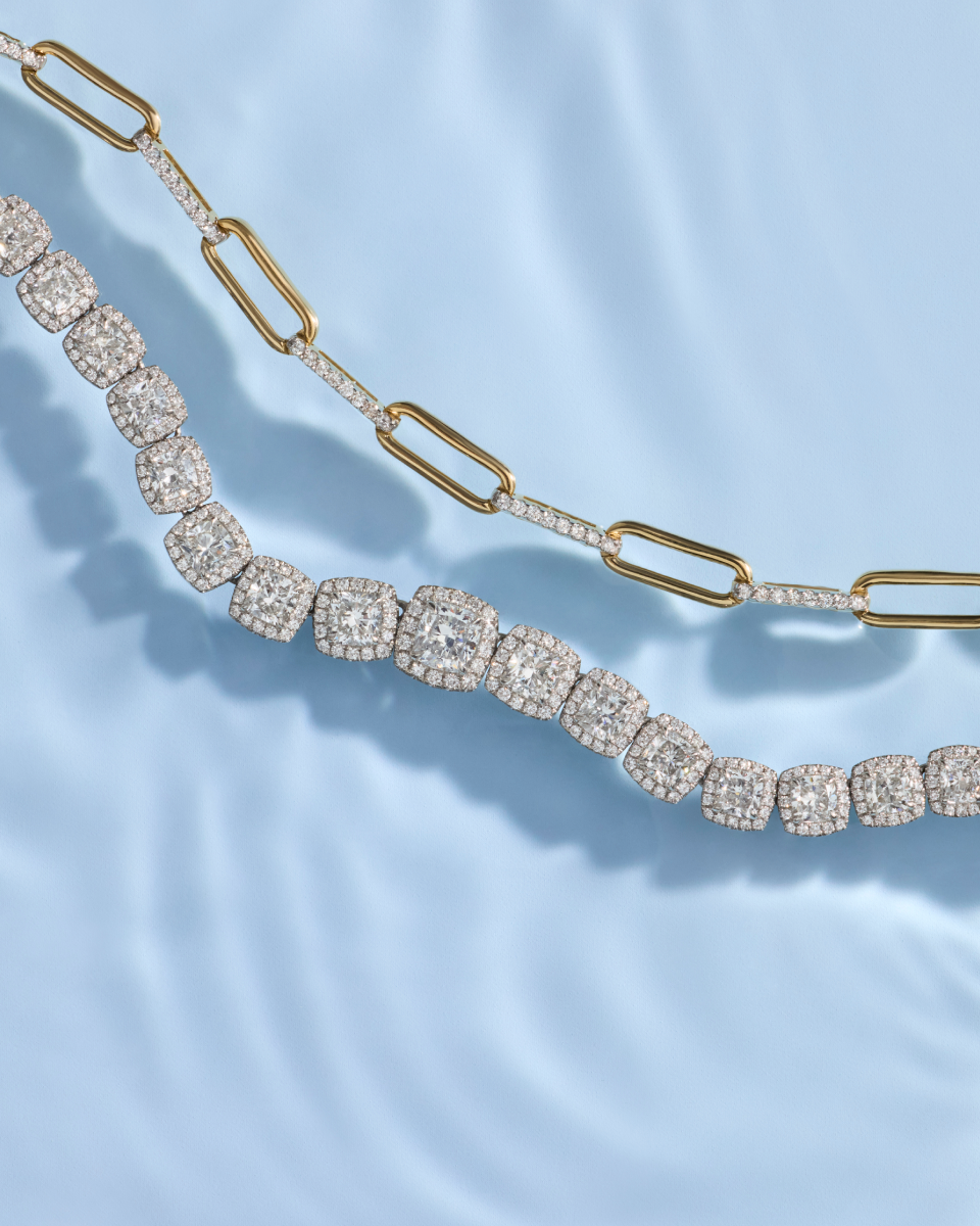 Diamond necklace and tennis bracelet layered together for the Blue Nile Summer Sale
