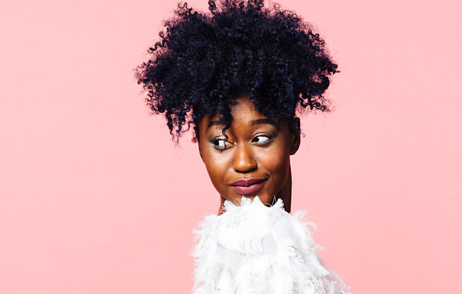 A bride wearing the natural pineapple puff hairstyle