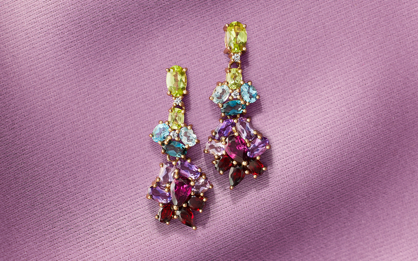 Bold statement earrings with multiple gemstones in a dangling design. 