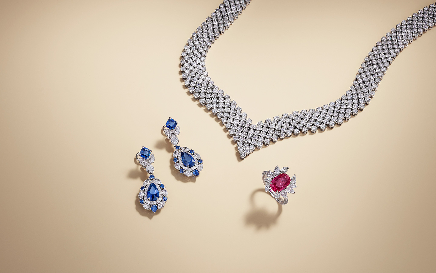 Diamond necklace, sapphire and diamond earrings and a ruby diamond ring.
