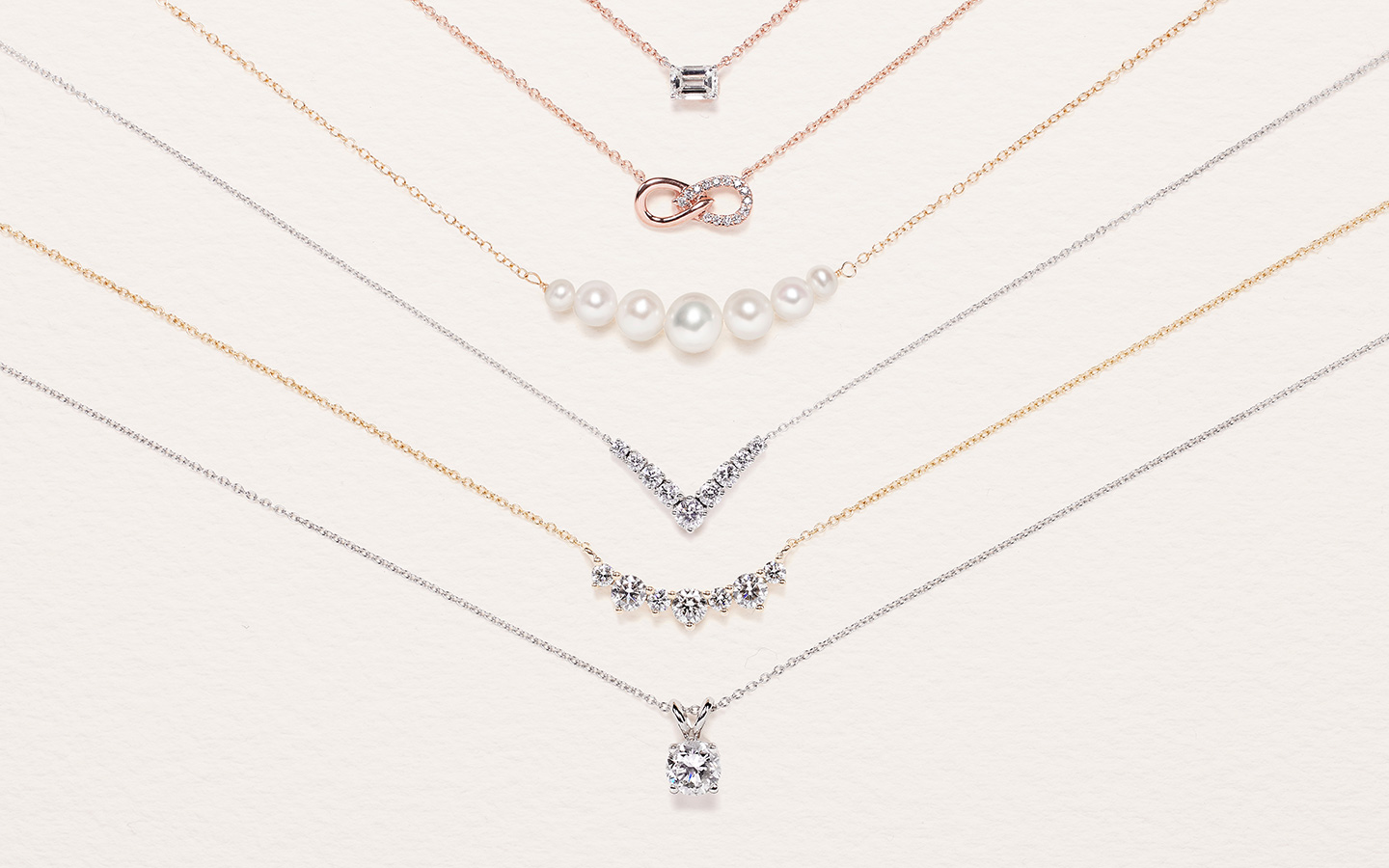 Six diamond and pearl necklaces in gold, including minimalist necklaces. 