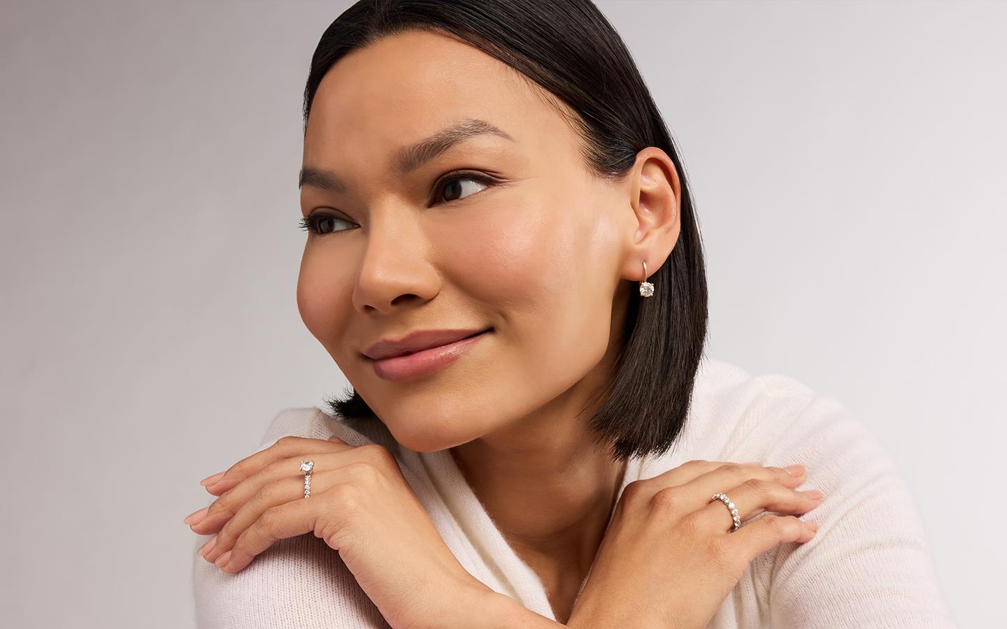 Woman wearing Blue Nile diamond jewelry