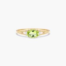 Oval Peridot And Diamond Accent Birthstone Ring In 14K Yellow Gold