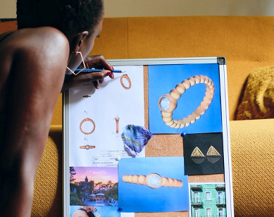 The designer working on her mood board for Ten/Ten