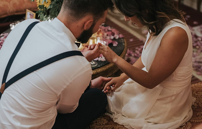 Newly engaged couple admire their diamond engagement ring