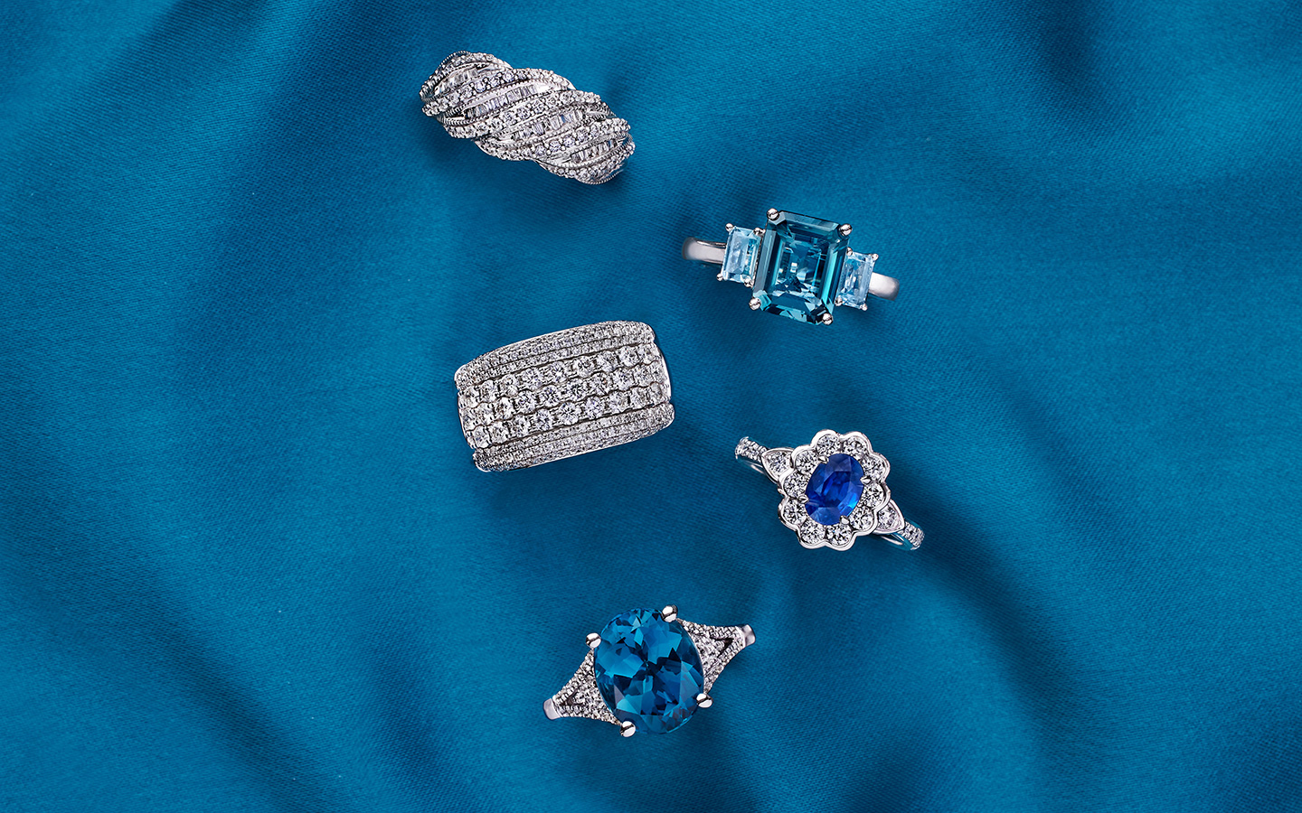 Five diamond and gemstone rings, including promise rings.