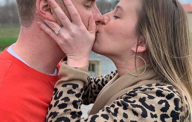 Rebeka wearing her diamond engagement ring gives Drew a kiss