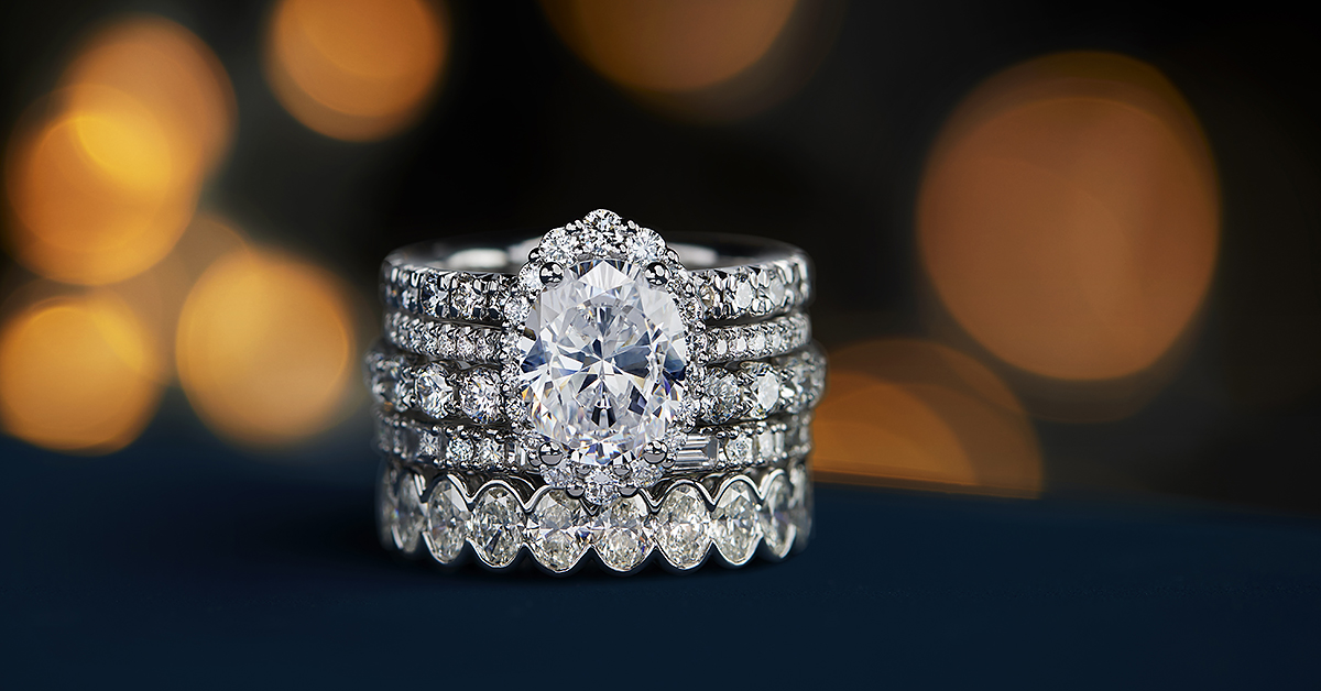 Stack of diamond wedding rings and engagement ring in white gold and platinum.