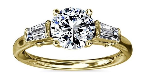 Yellow gold and three diamond ring.