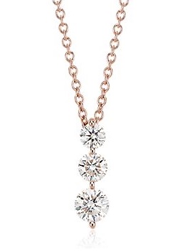 Rose gold necklace with three diamonds in graduating sizes.