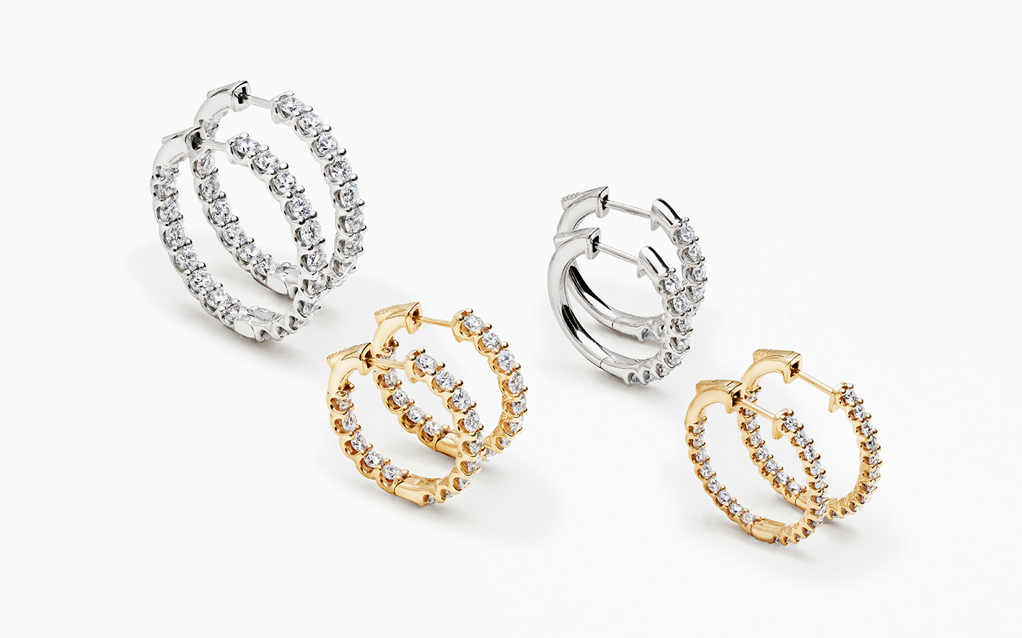 Four pairs of waterproof gold hoop earrings with diamonds. 