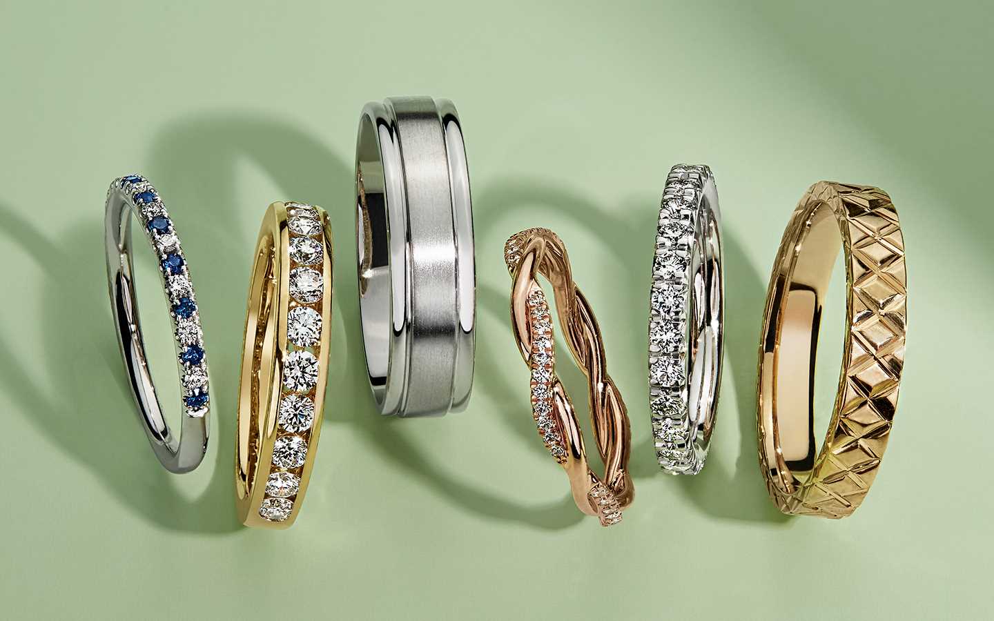 Six men's and women’s wedding bands including eternity, diamond, gold and gemstone rings.