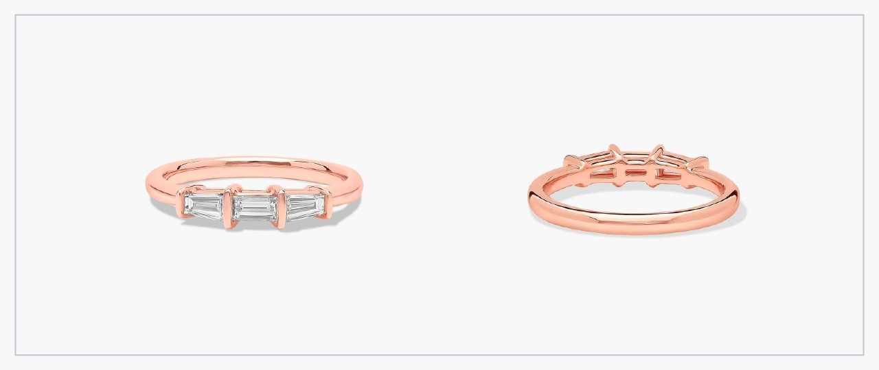 Front and side views of a rose gold diamond bar ring