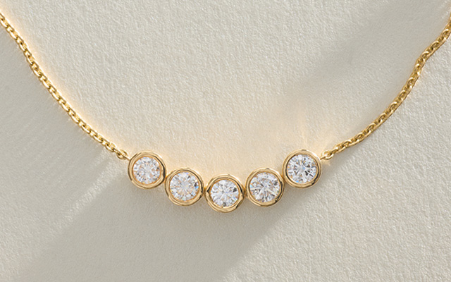 Bezel set diamond necklace in 14k yellow gold