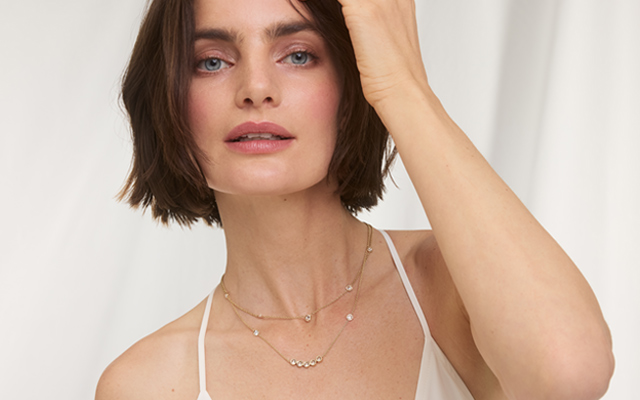 Woman wearing bezel setting jewelry