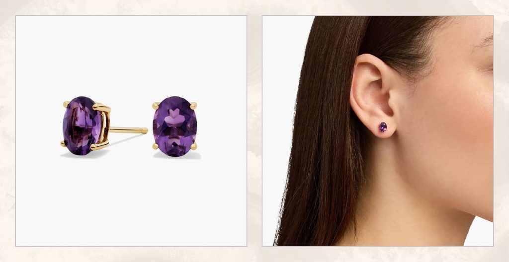 Woman wears amethyst birthstone earrings.