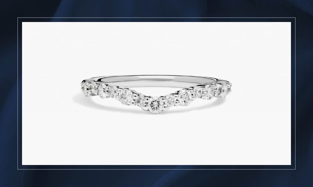 A curved Blue Nile wedding band.