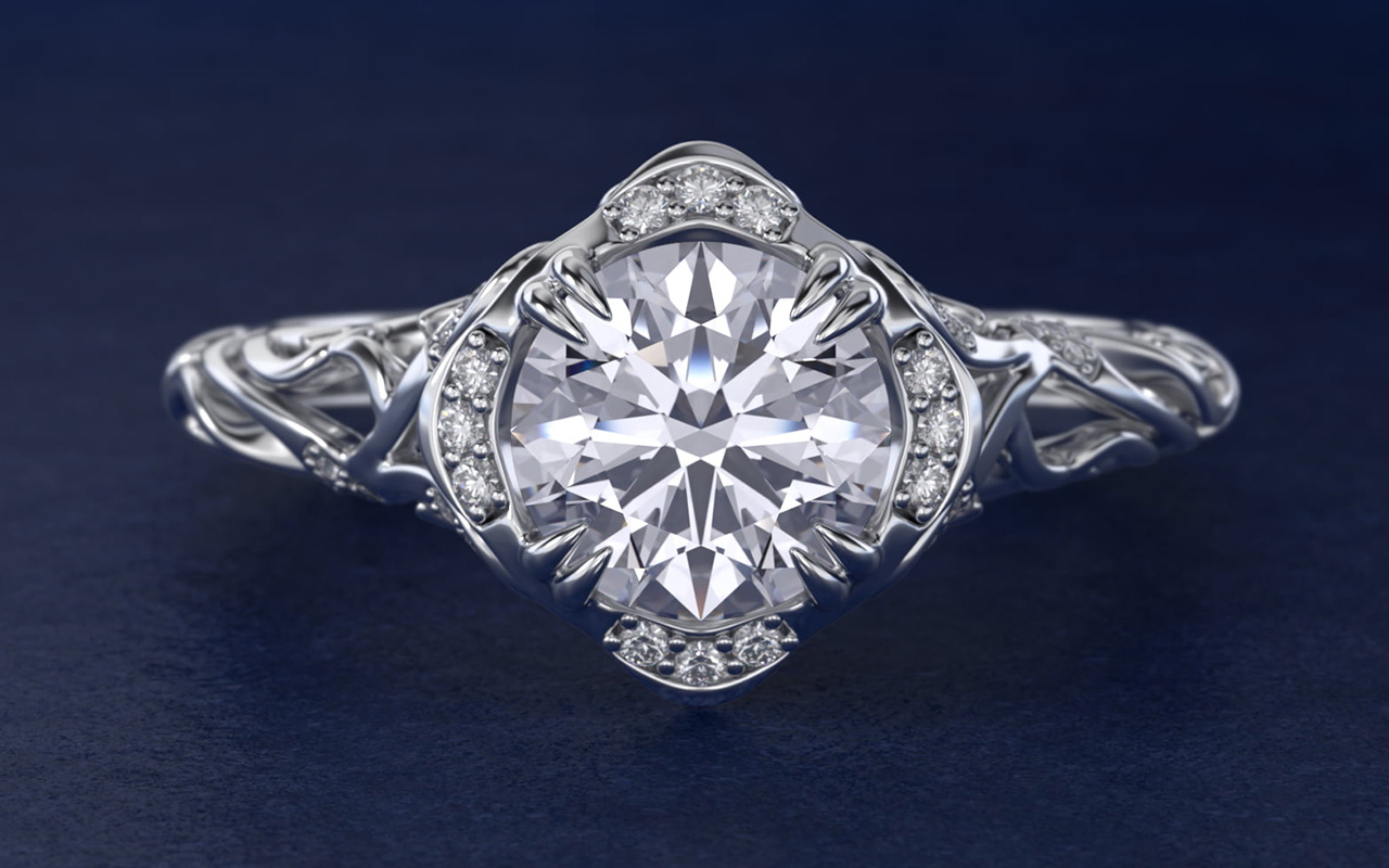 Diamond filigree vintage-style engagement ring in platinum featuring intricate metalwork and a round center diamond