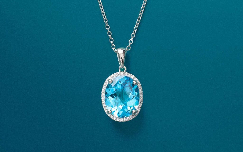 Blue topaz pendant with halo