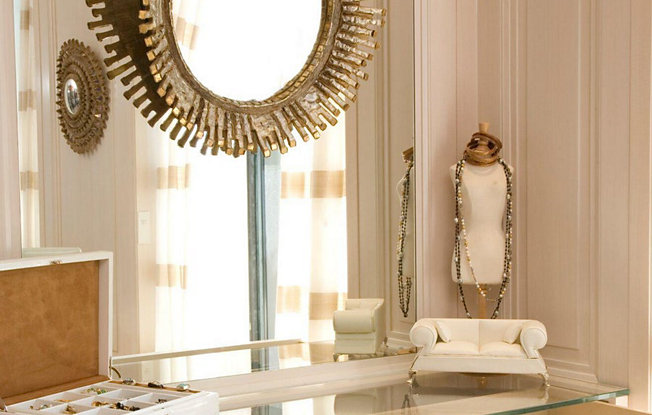 Jewelry display including a mirror and a small necklace display.