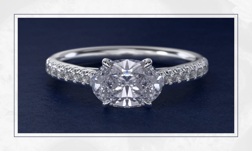 Oval diamond set horizontally on a slim band, reflecting a modern east-west style that often appears in trending engagement rings