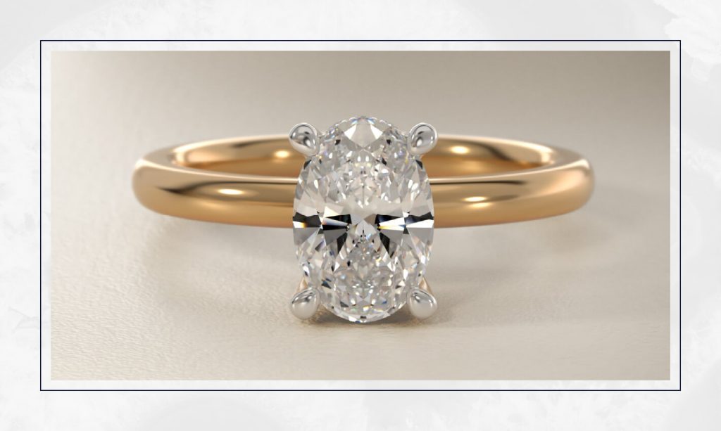 Yellow gold solitaire with an elongated oval diamond, a clean and elegant shape that continues to lead engagement ring trends