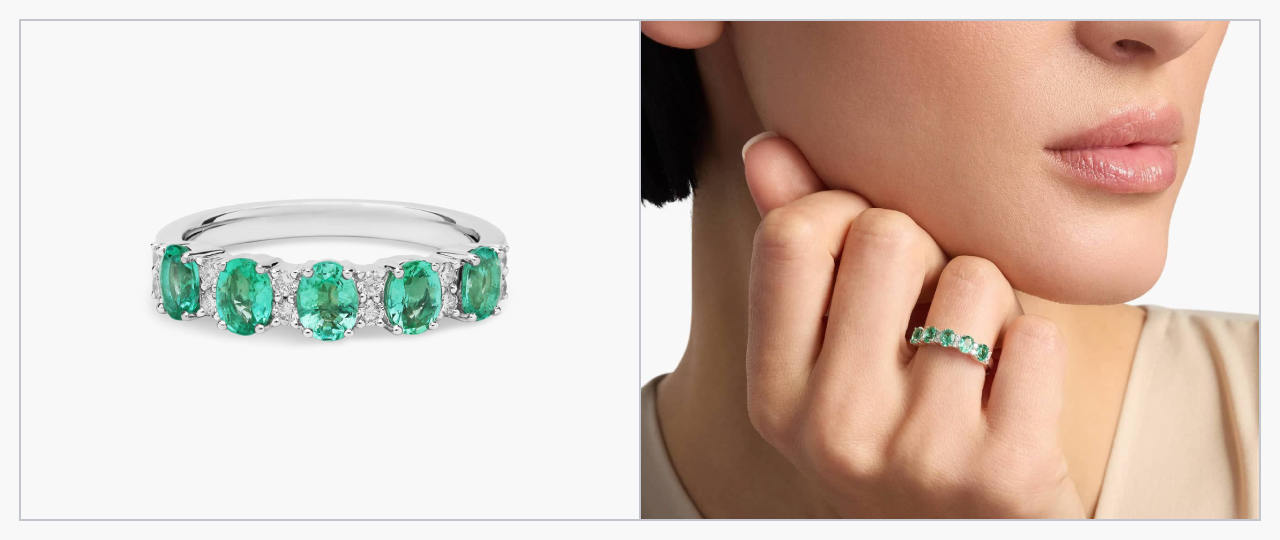 A white gold ring with five emeralds